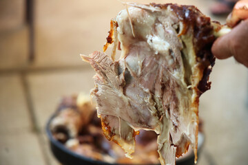 Roast Leg of Lamb. Cooking lamb carcass on a spit over hot charcoals outdoors during the holiday. Traditional Serbian roasting lamb. 