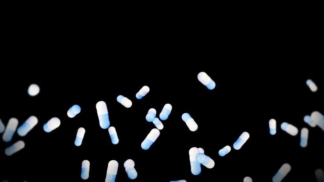 Flying many medical capsules on black background. Medicine and pharmaceutical concept. 3D animation of blue pill capsule rotating. Loop animation.