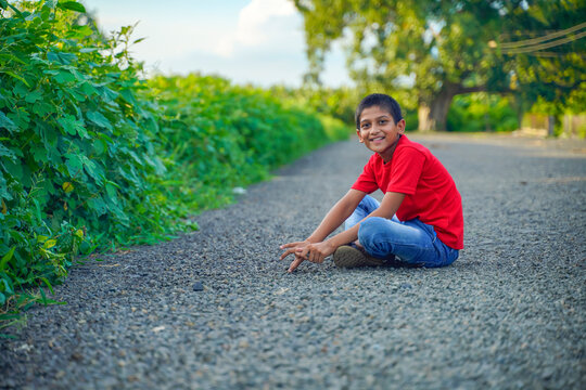 indian child playing with stone