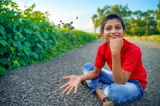 indian child playing with stone