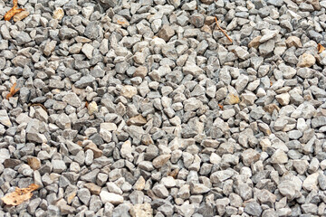 small road stone background, dark gravel pebbles stone texture. Closeup top view gravel. Gravel in garden. Pattern