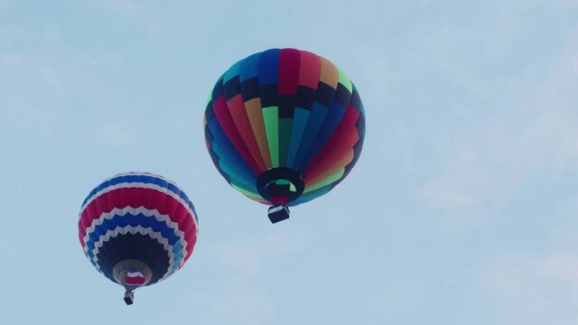 Colorful Hot air balloons flying on sky background.