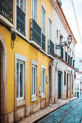 Fototapeta na wymiar Old Town Lisbon. Street view of typical houses in Lisbon, Portugal, Europe