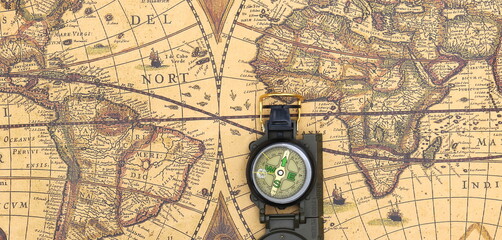 Fototapeta na wymiar Classic round compass on background of old vintage map of world as symbol of tourism with compass, travel with compass and outdoor activities with compass
