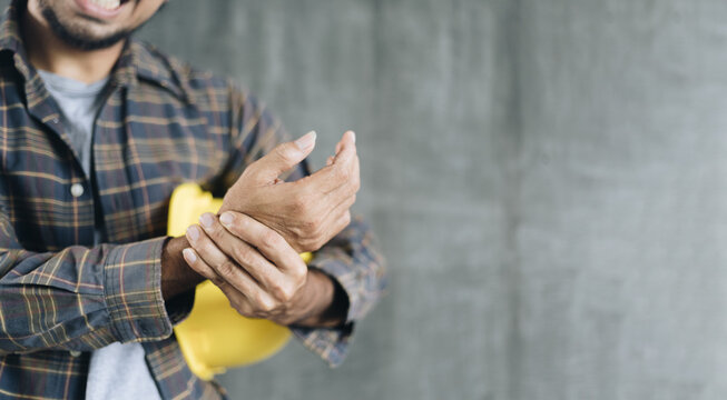 Construction workers have wrist pain from work with copy space