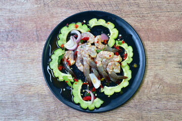 raw shrimp dressing spicy and sour fish sauce Thai food on plate