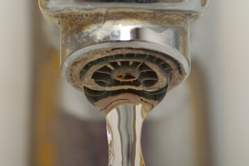 Water dripping from a faucet in the bathroom