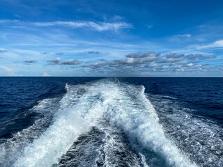 The white waves under the blue cloud that shot from the ferry ship  to Koh Tao, Thailand
