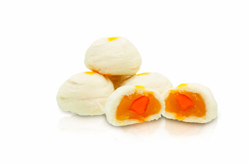 Three white Chinese pastry with yellow dots in the center and cut in half to reveal a red salted egg and soy filling isolate on white background with clipping path.