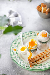 Soft-boiled egg in an eggcup with toast