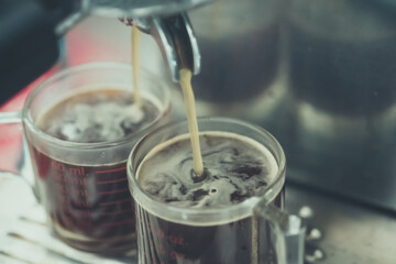 Dual shot espresso being made from machine