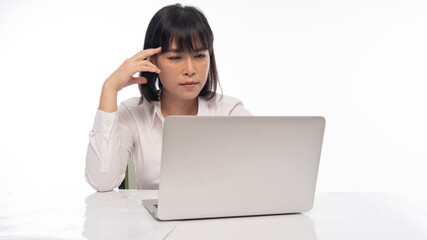 Office lady Working on laptop, stressed posture, working woman concept.