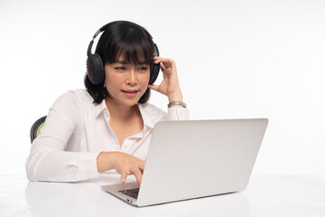 Office woman wearing headphones for online meeting on laptop
