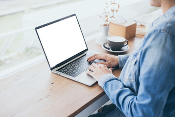 computer mockup blank screen.hand woman work using laptop with white background for advertising,contact business search information on desk at coffee shop.marketing and creative design