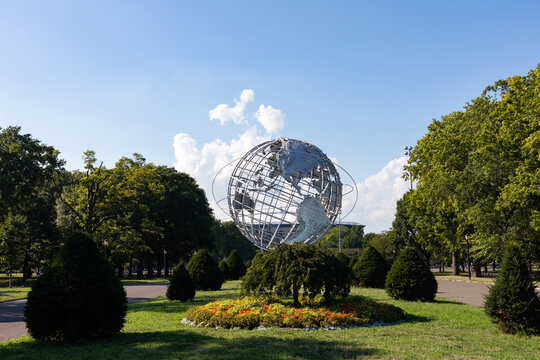 Unisphere Globe at Flushing Meadows Corona Park during Summer with Beautiful Flowers and Trees on July 29, 2020 in Queens, New York