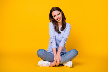 Portrait of her she nice attractive pretty cute sweet shy modest cheerful cheery girl sitting lotus position enjoying isolated bright vivid shine vibrant yellow color background