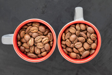 Coffee beans in a coffee cup. top view