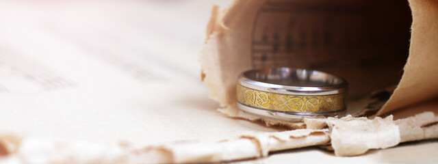 Gold wide ring and paper musical notes