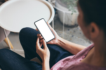 cell phone mockup blank white screen.woman hand holding texting using mobile on desk at coffee shop.background empty space for advertise.work people contact marketing business,technology
