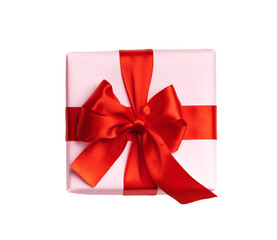 Pink gift box with red bow isolated on white background. Top view. Flat lay.