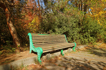 Empty vintage bench in an autumn park