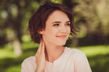 Naklejka premium Photo of charming cute lady hand neck beaming smiling dreamy look watch children dogs having fun throw toys playing city park playground relax chill wear white shirt outdoors