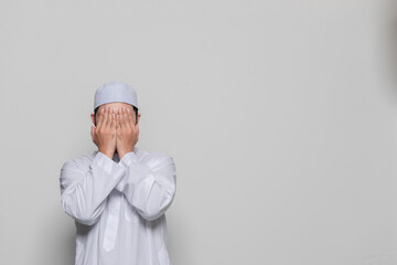 Portrait of smart handsome muslim man on white background,Ramadan festival concept