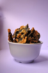Snacks food, chips of A. auricula-judae Mushroom on a white bowl