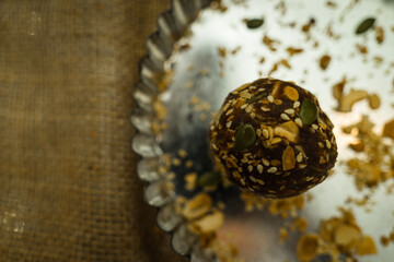 Mixed components inside moon cake, homemade cantonese moon cake pastry on baking tray before baking for traditional festival.