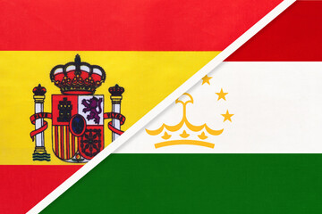 Spain and Tajikistan, symbol of two national flags from textile. Partnership between European and Asian countries.