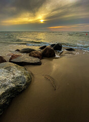 
sunset on the beach with stones
