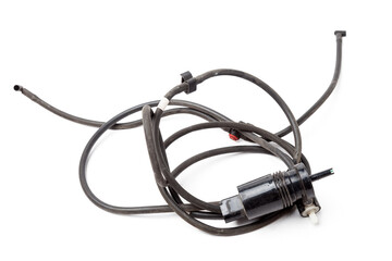 Black plastic glass washer pump reservoir with wire and hose on a white isolated background in a photo studio - for sale or replacement when repairing a car in a car service.
