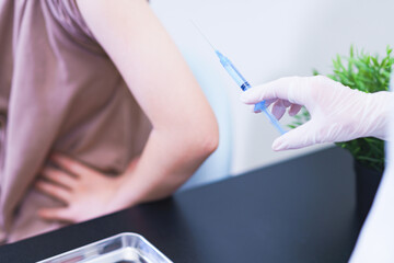 corona virus vaccine injection to young woman