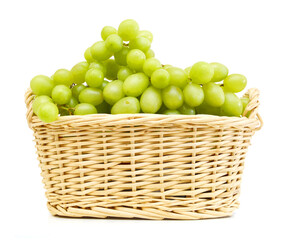 Green Grapes in basket isolated on a white background