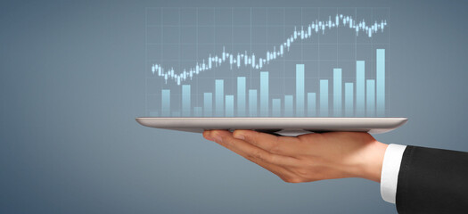 Businessman plan graph growth  increase of chart positive indicators in his business, tablet in hand
