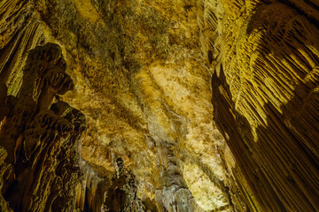 Panoramic view onto ceiling & walls of cave Astim or Asthma, Kizkalesi, Turkey. They are covered by...