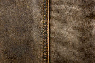 clothing items stonewashed cotton fabric texture with seams, clasps, buttons and rivets, macro