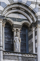 Obraz premium Fragment of Cattedrale di San Lorenzo (Cathedral of Saint Lawrence, 1118) in Genoa, Italy. Cathedral dedicated to Saint Lawrence (San Lorenzo) and is seat of Archbishop of Genoa.
