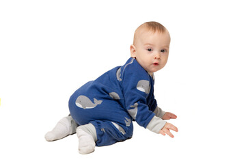 Baby in blue overalls on a white background.