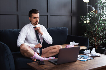 Businessman without pants during job interview or online meeting during distant work from home