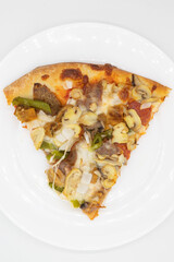 Slice of Supreme Pizza on a White Plate with a White Background