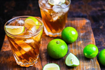 Iced lemon tea and lemon on a wooden table