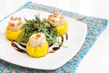 Sauteed scallops with saffron potatoes.