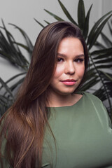Fototapeta premium Portrait of pretty young smiling woman with beautiful hairstyling