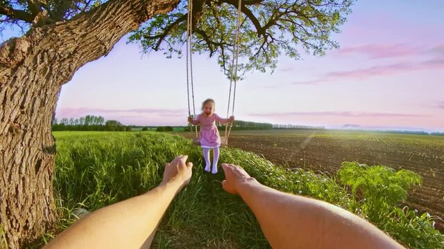 POV Father Swinging His Child Playing Under A Tree During Sunset Travel Restrictions Happy Family 360 Vr Footage First Person 8k Slow Motion