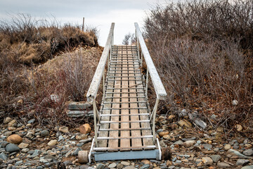 A walkway leading to Maine's rocky coastline.  - 376940101