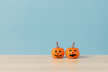 Halloween holiday concept with jack o lantern smiling face and blue background