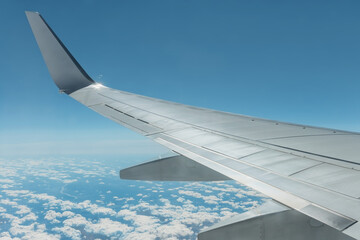 Obraz premium View from airplane window on wing and sky with clouds