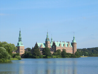 Red brick scandinavian castle on the lake, Denmark