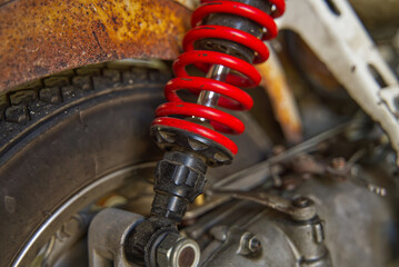 Red suspension absorber for Old motorcycle vintage and beautiful.